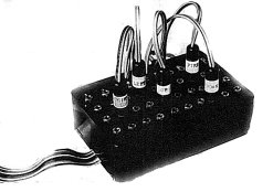 The Pickard joystick interface is a small black rectangular box with an array of 40 sockets and 6 jack plugs.