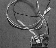 The Compusound Telesound is a small rectangular circuit board with 3 wires which connect to the inside of the ZX Spectrum